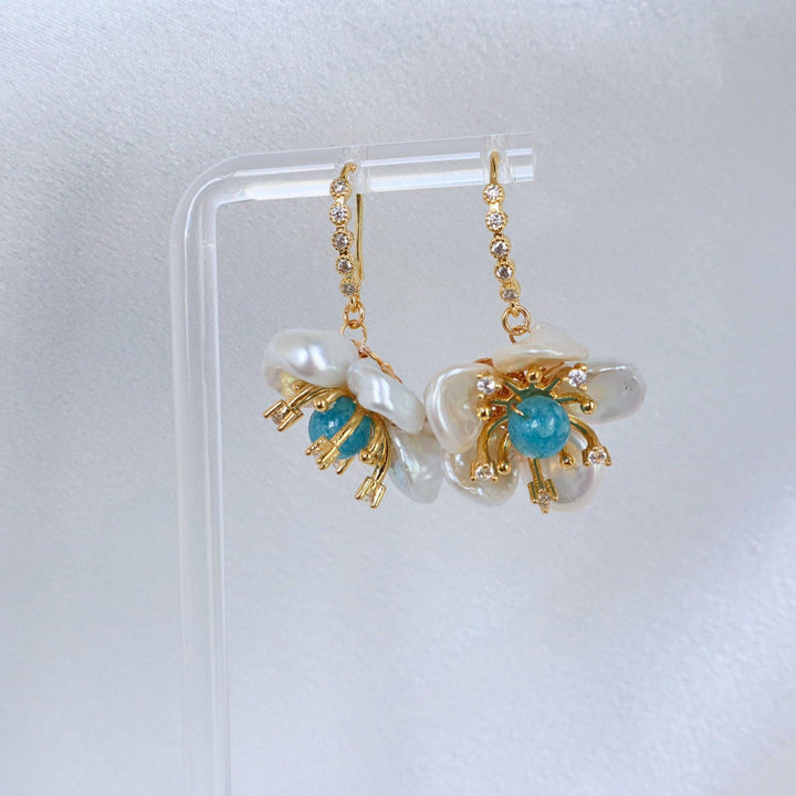 Pearlpals Baroque pearls earrings in petal flower shape with blue gem