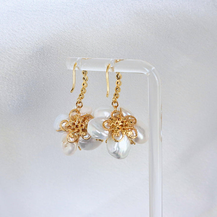 Pearlpals Baroque pearls earrings in petal flower shape with blue gem