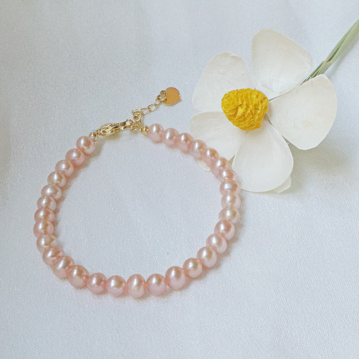 Pearlpals The pink freshwater pearl bracelet crafted from gold-plated materials.