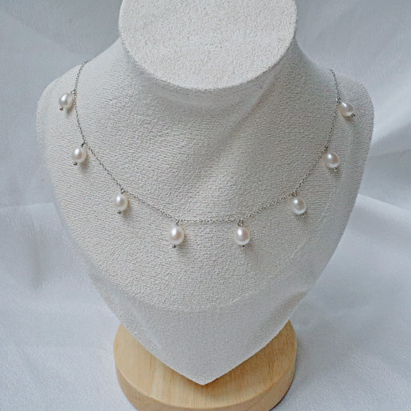 Pearlpals A sterling silver necklace with pearls evenly spaced along a delicate chain